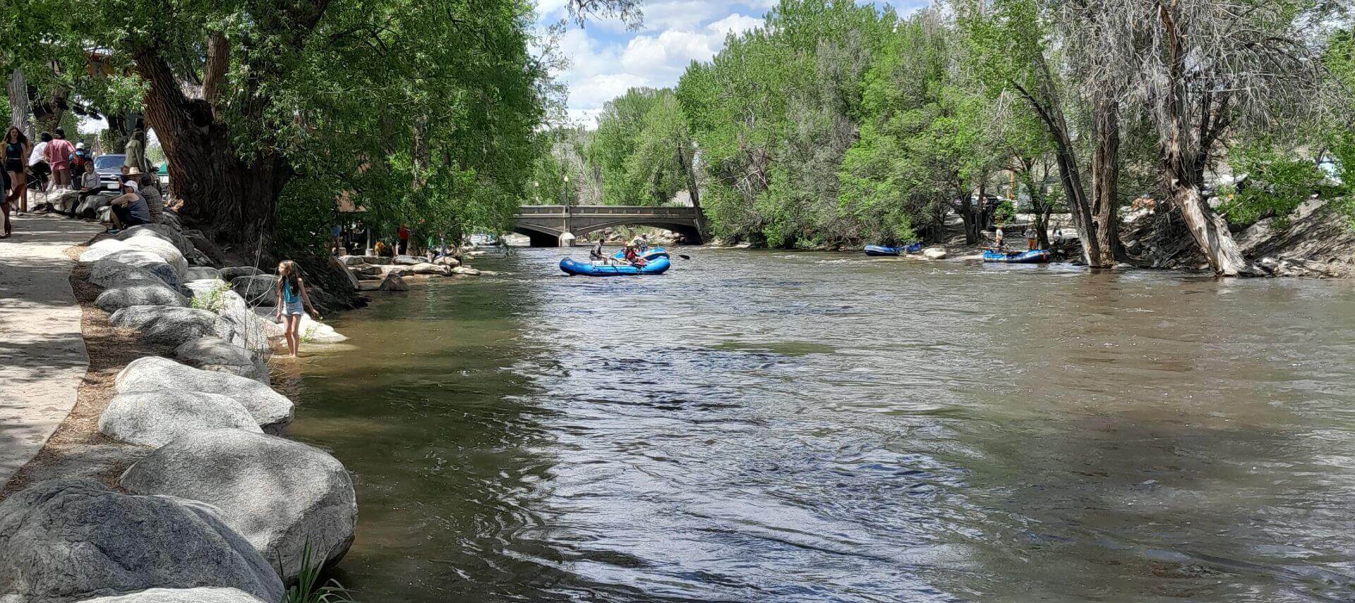 Summer day with raft floating on the river.