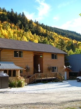 Fall colors surrounding Ski Town Condos on a sunny day.