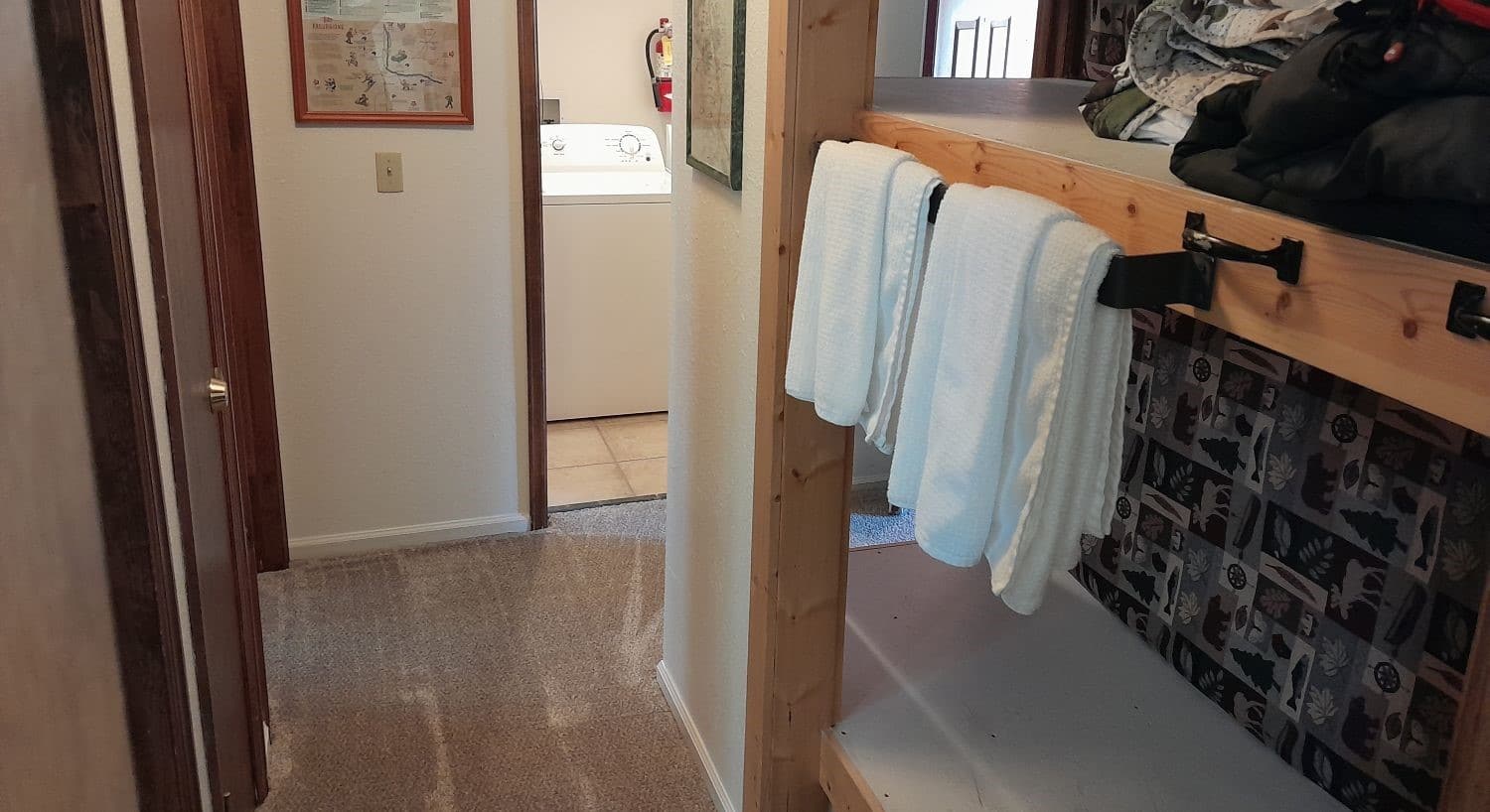 Storage shelves holding towels and blankets