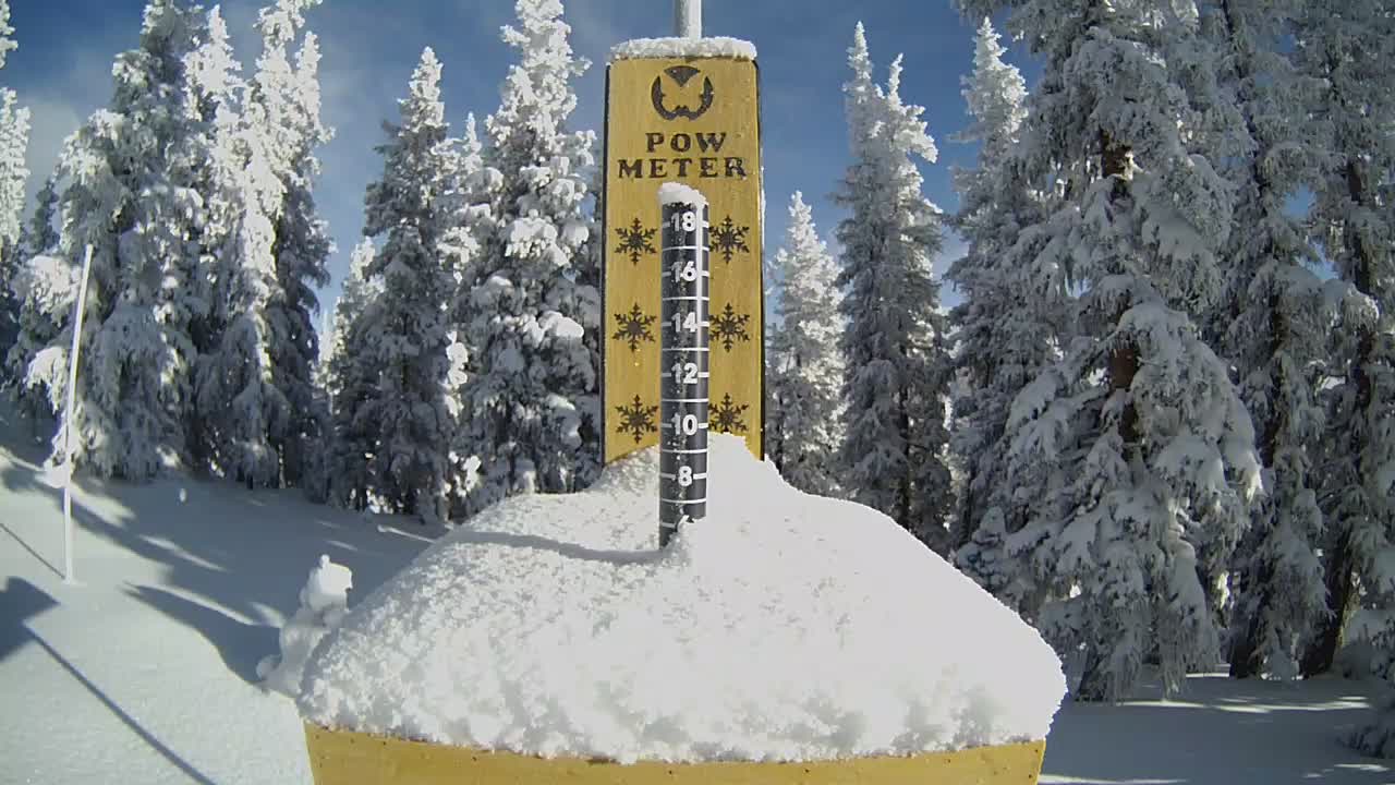 Sunny day snow meter showing 6 inches of fresh snow.